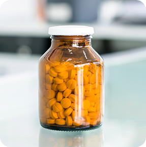 small-pills-amber-medicine-bottle